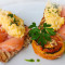Scrambled eggs with smoked salmon and grilled tomato